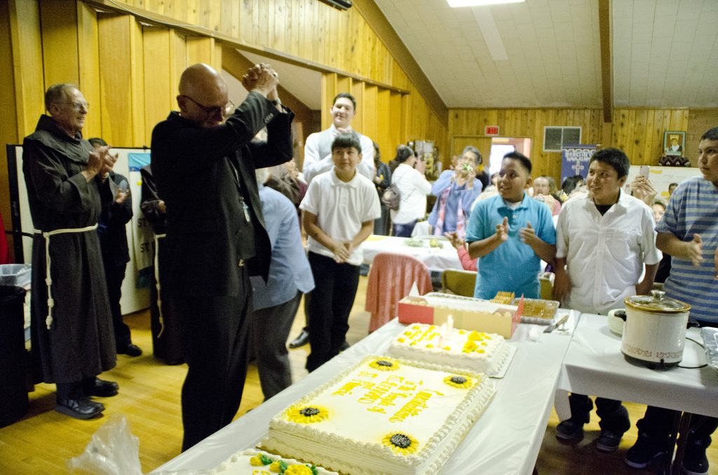 The anniversary of the church also happened to be Bishop Wall's birthday. The people surprised him with a cake after the Mass.