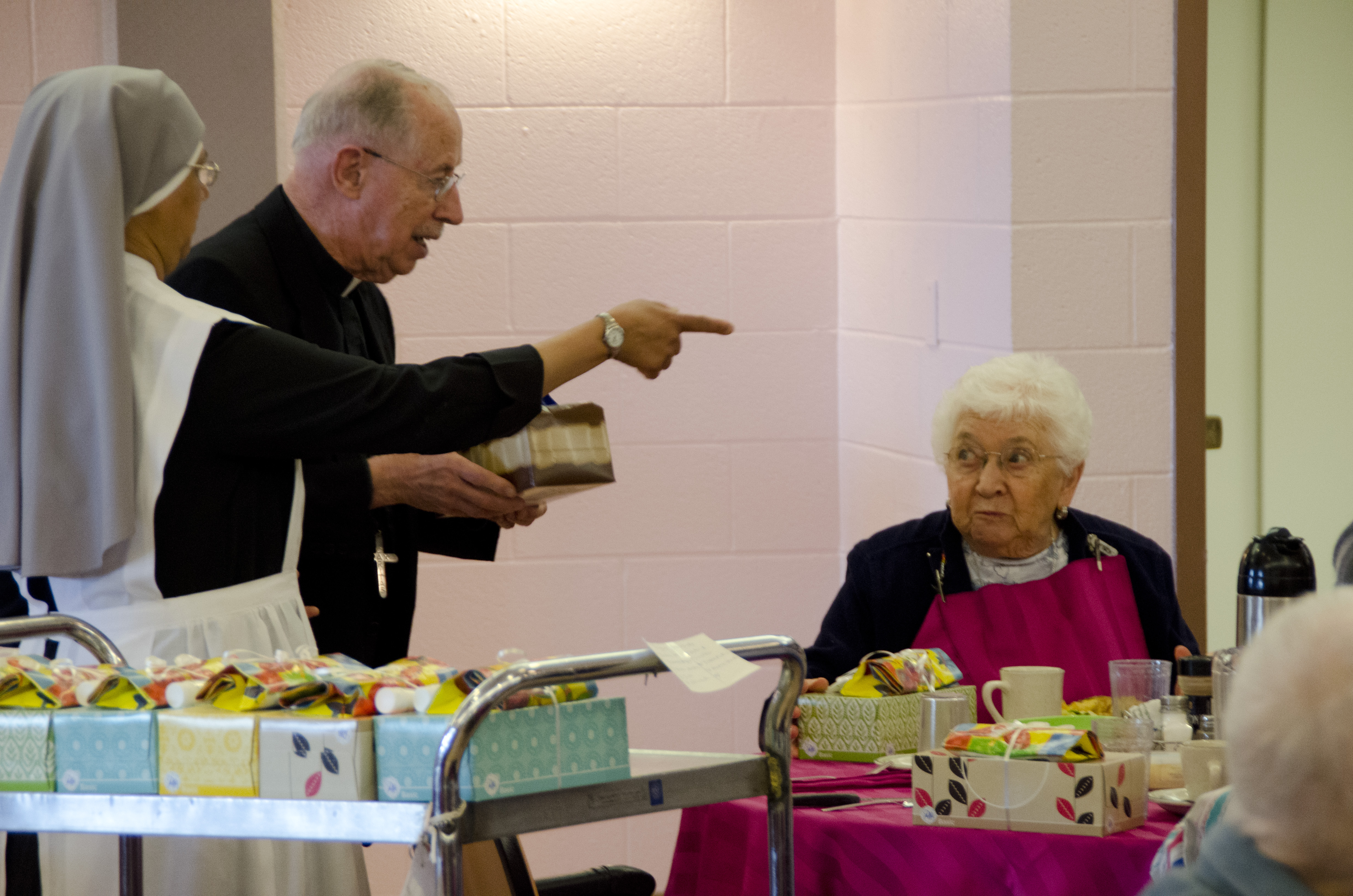 The sisters joined together with priests from the Diocese to distribute gifts and serve the noon meal to residents on the Feast of St. Joseph.