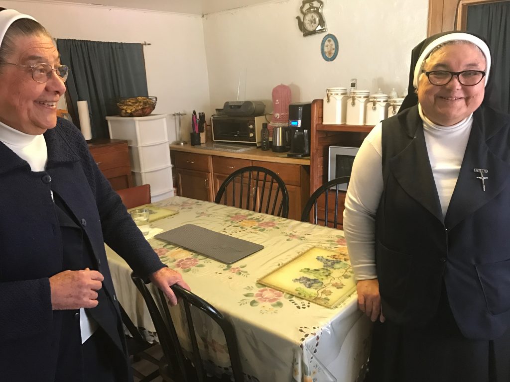 Mother Magda, left, and one of her sisters in their small kitchen.